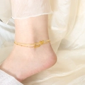 Double-layered 18k gold heart and Love letter ankle bracelet for women on beige fabric - Gold Double Layer Anklet (S119)