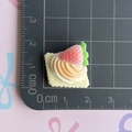 Macro detail of 2cm resin strawberry cake charm for DIY crafts on a measurement mat - Cream Strawberry Biscuit
