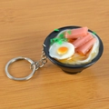 Realistic Japanese ramen bowl keychain with poached egg and ham slices on wood background - Ham and Egg Noodles with Keychain / 5cm x 2cm x 2.5cm