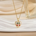 Elegant gold chain necklace with red cherry heart pendant on a soft fabric background - Heart Enamel Cherry Style (XL0587)