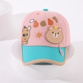 Close-up of pink and blue baby baseball cap with cartoon bear patch and B pendant - 48-52cm / Pink