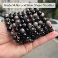 Handheld display of 5A natural silver sheen obsidian beads with metallic flash - 5A Natural Silver Obsidian Bracelet 6mm/Approx 27pcs