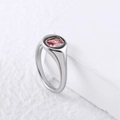 Detailed view of square pink zircon stone set on a polished silver stainless steel ring - US6 / Steel