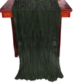 Vertical deep green crinkle gauze table runner draped over a dark wood furniture surface - Army Green