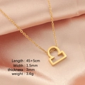 Golden Libra zodiac necklace on pink satin background with detailed dimensions - Libra
