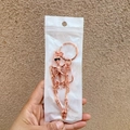Rose gold human skeleton keychain with metal ring and clasp in protective packaging - Bag Packaging / Copper
