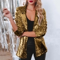 Detailed close-up of shiny gold sequined blazer texture with stylish notched lapel design - Gold