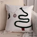 Christmas tree and sock embroidery pillow on cream sofa for festive home decoration - Embroidered Square Pillow / White Christmas Tree Style