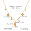 Plan détaillé du collier doré montrant les dimensions des pendentifs étoile et coquillage - Style Tournesol Ananas Fleur Trefle (HC-N40538)