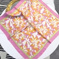 70cm square floral silk scarf in pink and yellow flowers on a white elegant table - 70x70cm / Pink