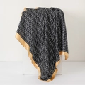 Elegant black silk headscarf with golden edges and white geometric G-pattern on a pedestal - Black Gold Border G-Pattern (No.29)