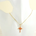 Detail of cross pendant featuring orange marquise stones and 18K gold plated chain - Gold Snake Chain / Red Zircon