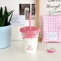 Close-up of clear plastic straw cup with pink bow patterns and text on the body - 470ML / Small Pink Bow