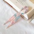 Elegant U-shaped acetate hair pin with pink and blue marble pattern on white fabric - Pink and Blue Floral
