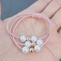 Three-piece pink elastic hair ties set featuring white pearls and gold metal bead accents - Three-Piece Set / Pink