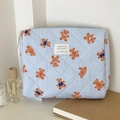 Macro detail of quilted teddy bear pattern on blue striped cotton makeup storage bag - Clutch Bag / Blue Striped Bear