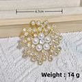 Golden eight-pointed star brooch with rhinestones and white pearls on fabric - KC Gold Five Pearls Star