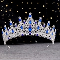 Macro detail of silver crown with blue pear-shaped crystals and sparkling white rhinestones - Silver Royal Blue Crystal