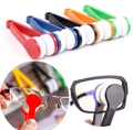 Portable microfiber eyeglass cleaning tools in five colors shown in use and flat lay - Random Style