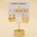 Golden earring set with pearls, resin hoops, and minimalist studs on display stand - Vintage Relief Pearl Twisted (31)