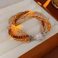 Multi-layer faceted amber crystal bead bracelet with a sparkling crystal-set magnetic clasp - Bracelet-Amber