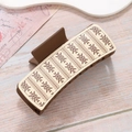 Brown matte rectangle hair claw clip with cream geometric pattern on wood surface - Brown Vintage Wave Geometric