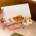 Set of 3 earrings with pearls, amber hearts, and matte gold geometric drops on white card - Heart Resin/Geometric (11# Silver Earring Post)