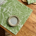 Green cotton linen placemat with white plant leaf patterns on rustic wood table - Green Leaf