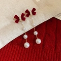Close-up of red velvet bow earrings with long pearl drop and 14k gold plating details - 3# Silver Needle - Long Red Velvet Bow Pearl Drop Earrings