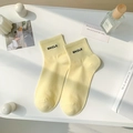 Light yellow combed cotton mid-tube socks with black SMILE embroidery and ribbed cuffs - One Size / Milk Yellow