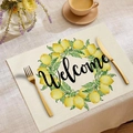 Linen placemat with lemon wreath and Welcome text on beige textured tabletop - Welcome Lemon Wreath