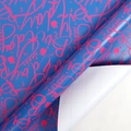 Dark blue Happy Birthday wrapping paper with pink stars and a cutting grid on the back - Fluorescent Pink Alphabet