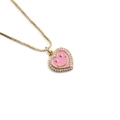 Pink enamel heart necklace with golden smiley face and zircon border on gold chain - Pink
