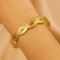 Chic gold woven open bangle with brushed texture finish shown on a woman wrist - Double Strand Braided Brushed (DZ-475)