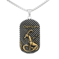 Macro shot of rectangular Capricorn pendant with golden sea-goat motif and silver chain - Capricorn