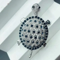 Detailed view of silver turtle brooch with dark blue rhinestones for women coat dress accessory - 5.5*3.2*1.4cm / Silver
