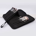 Macro detail of the internal elastic slots inside the black makeup brush organizer bag - 15-Hole Standing Makeup Bag
