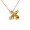18k gold plated bubble necklace featuring a crisscross pendant with green heart gemstone - Letter X