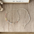 Close-up of bohemian braided belt with colorful beads and natural tassels on stone - Colorful Beans Style - 137cm