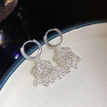 Macro detail of silver tassel earrings with hollow crown design and white pearls - Hollow Crown Lantern Pearl Tassel Style (52#)