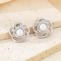Macro detail of silver floral petal earrings with a lustrous white pearl center - Silver Hollow Floral With Pearl (KE114632-KFC)