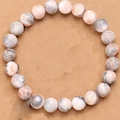 Pink Zebra Jasper bead bracelet with natural stone texture on a warm sandy background - Pink Zebra Without Charm Style