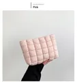 Detail of pink quilted cotton handbag with soft puffer texture and square grid design - Pink