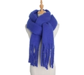 Thick mohair winter scarf with tassels in deep blue color on a beige mannequin - Navy Blue