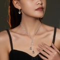 Silver water drop rhinestone jewelry set with necklace and earrings on model - Classic Water Drop Jewelry Set (DTN10026319S)