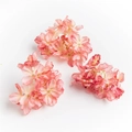 Detailed view of three pink artificial hydrangea petals with burnt edge craftsmanship - Nude