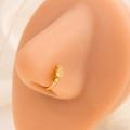 Detail showing gold nose ring with three clear zircons on a realistic model nose - E4876-2/Gold/Vertical 3-Diamond
