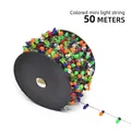 Multi-color mini LED light string 50 meters wound on a black plastic reel - Clear Multicolor Beads / 50 Meters/Roll