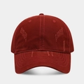 Close-up of distressed washed cotton texture and parallel stitching on wine red baseball cap - Dark Red