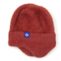 Detail of caramel knit earflap hat showing fluffy texture and snowflake label - Rust red